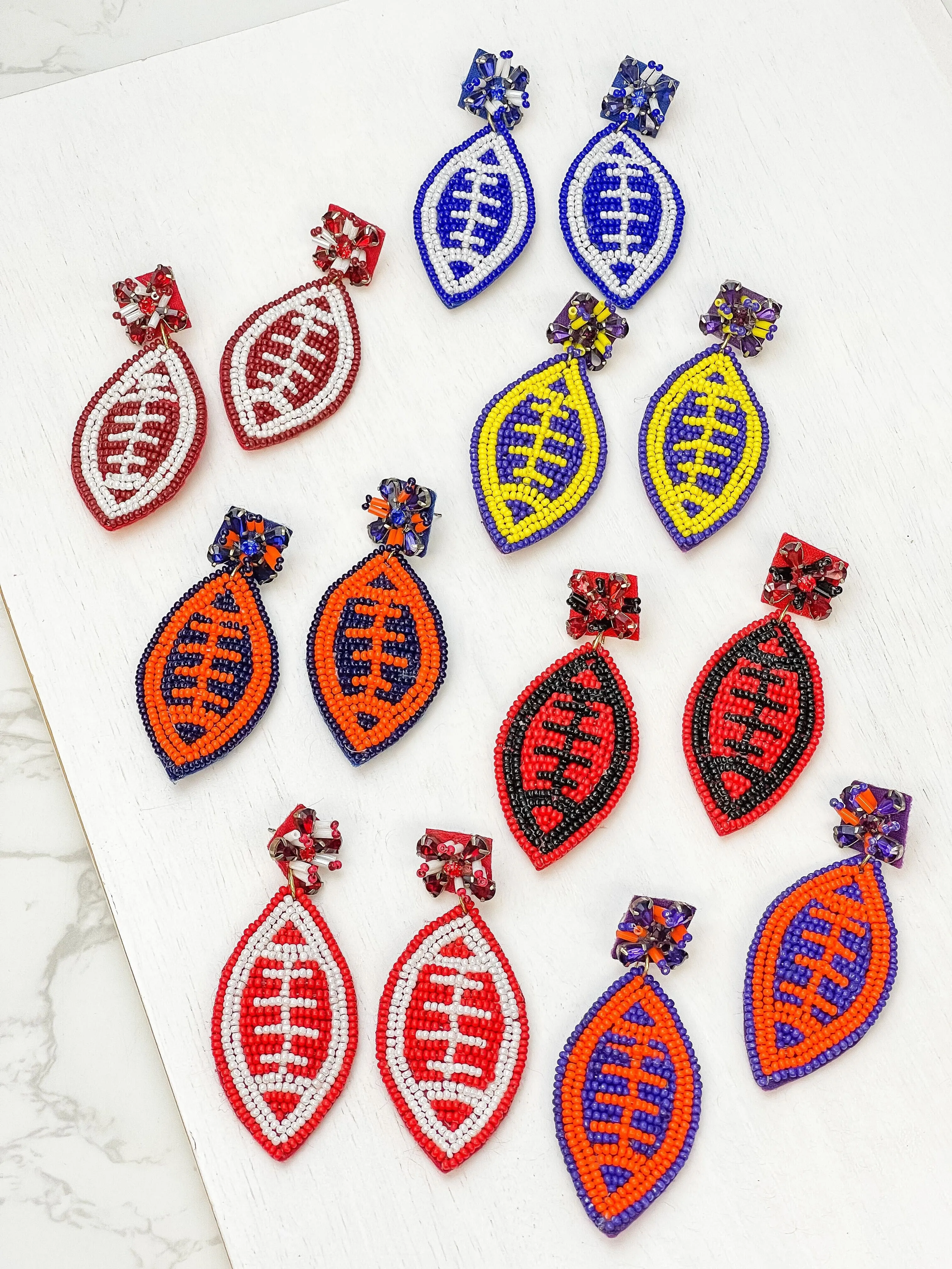 Glitzy Post Football Dangle Earrings - Purple & Orange